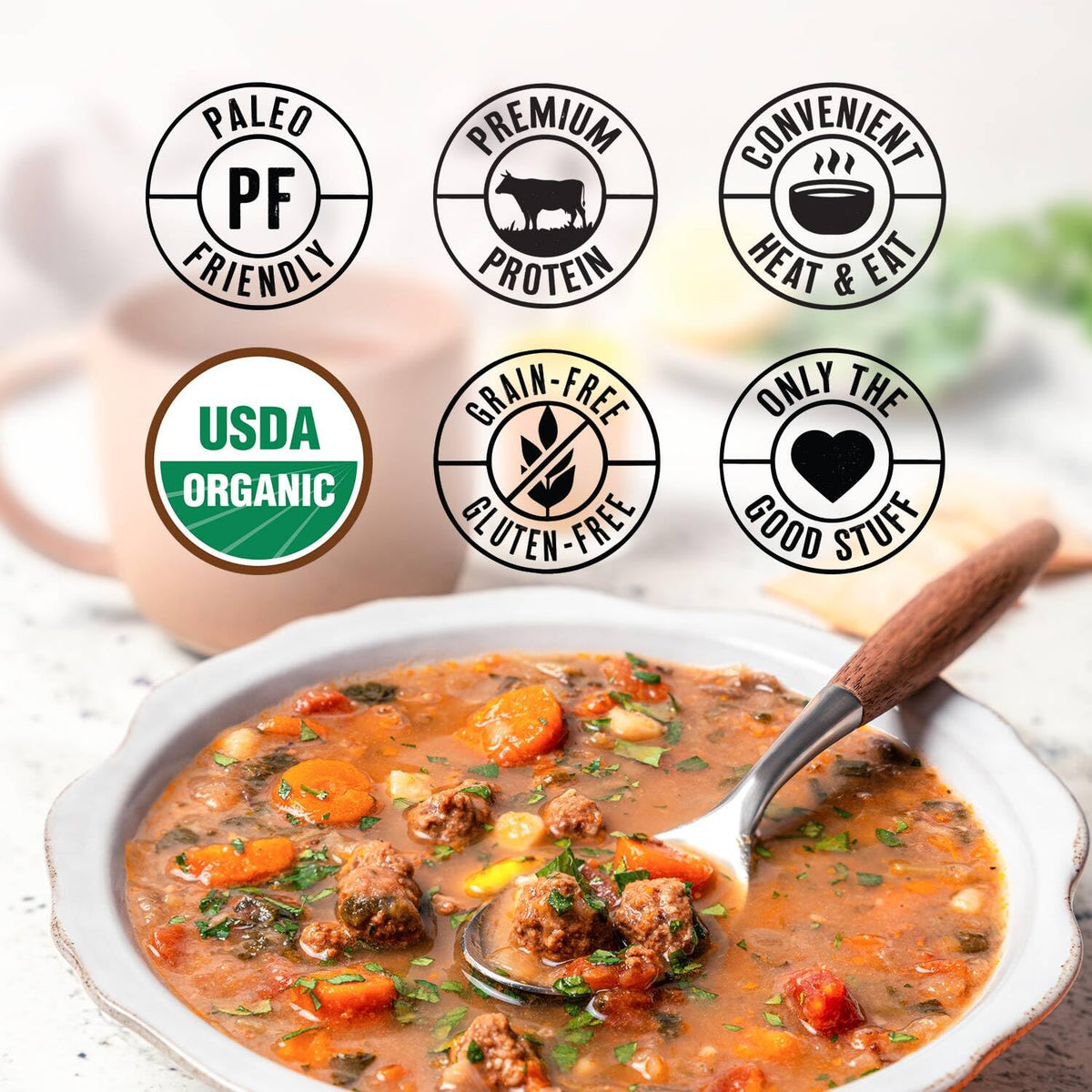 True Primal Hearty Beef Organic Soup broth steam closeup highlighting stock and gelatin