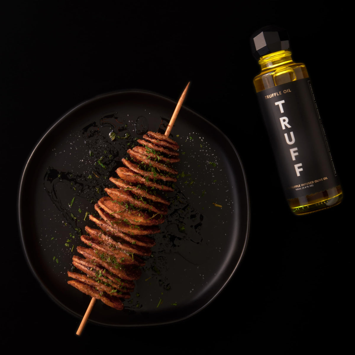 Pizza drizzled with TRUFF Black Truffle Oil for savory lift.