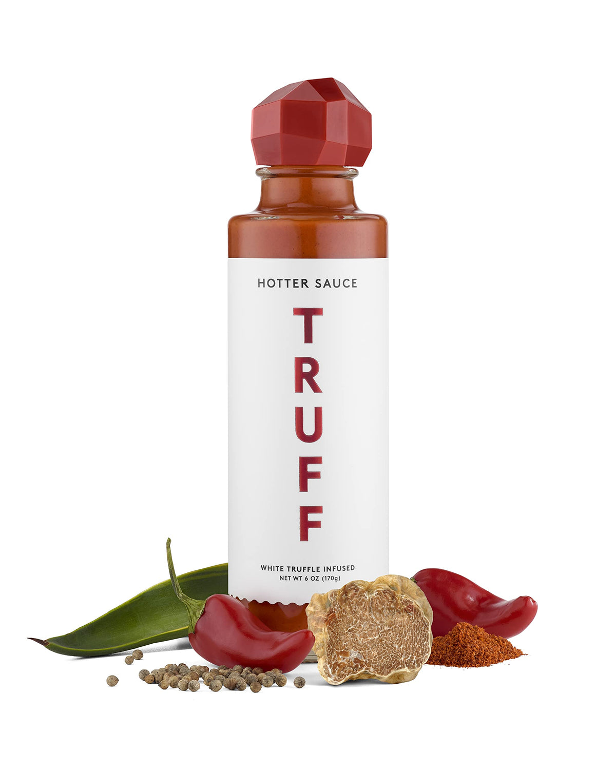 TRUFF White Hotter bottle pouring, adds bold heat to gourmet dishes.