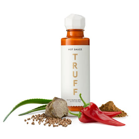 TRUFF White Truffle hot sauce bottle on tasting board for elevated meals