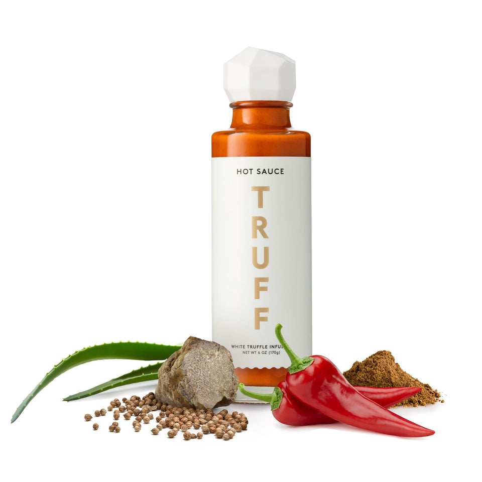 TRUFF White Truffle hot sauce bottle on tasting board for elevated meals