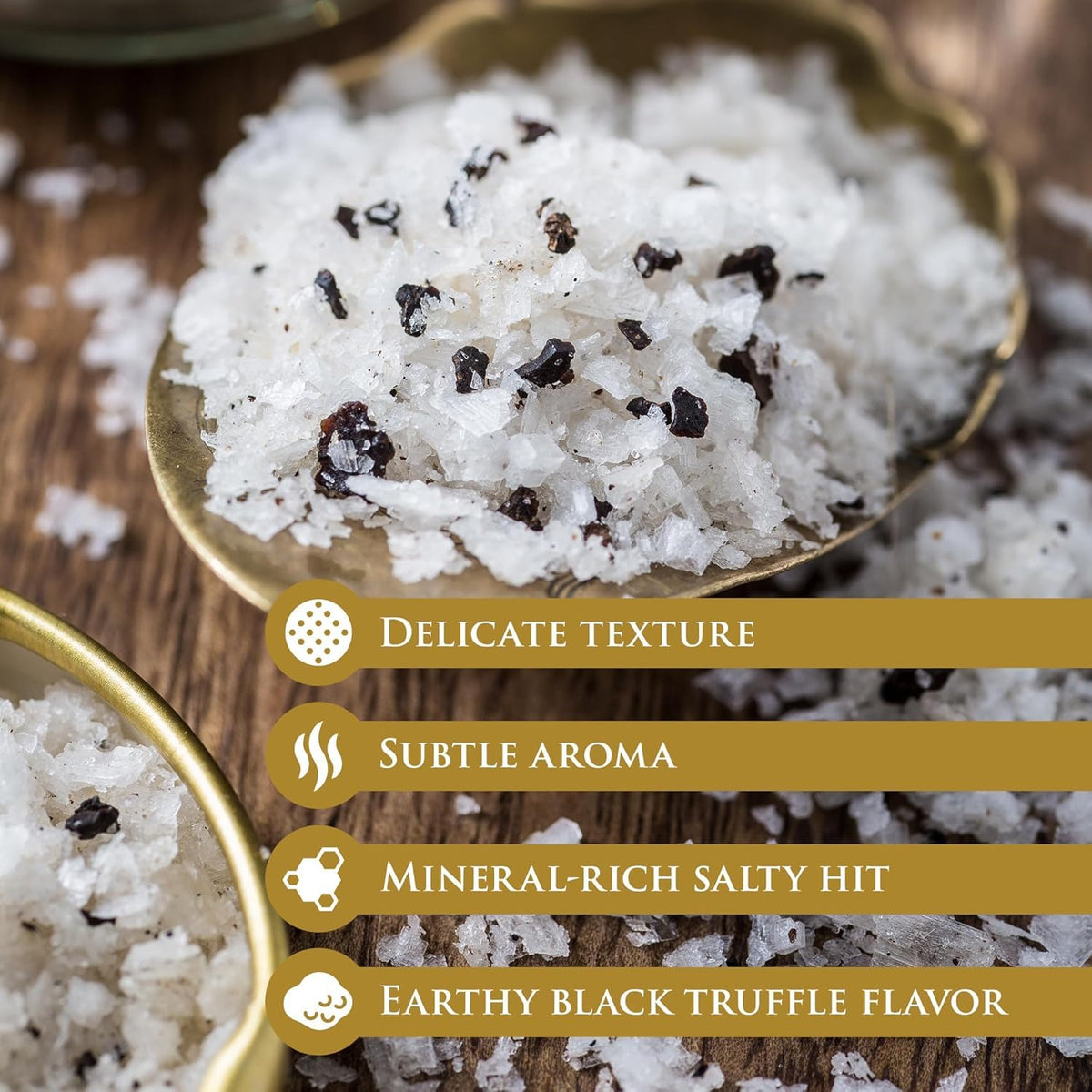 Jar of TruffleHunter black truffle sea salt flakes on a kitchen counter, a gourmet staple.