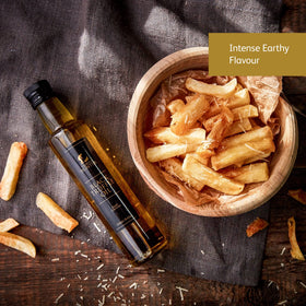 TruffleHunter oil drops on salad enhance aroma and depth.