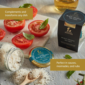 Pouring TruffleHunter salt flakes into a pan to enhance a pasta sauce.