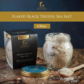 TruffleHunter sea salt flakes with visible truffle pieces, great for finishing sauces.