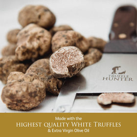 Closeup of TruffleHunter label on white truffle oil bottle.