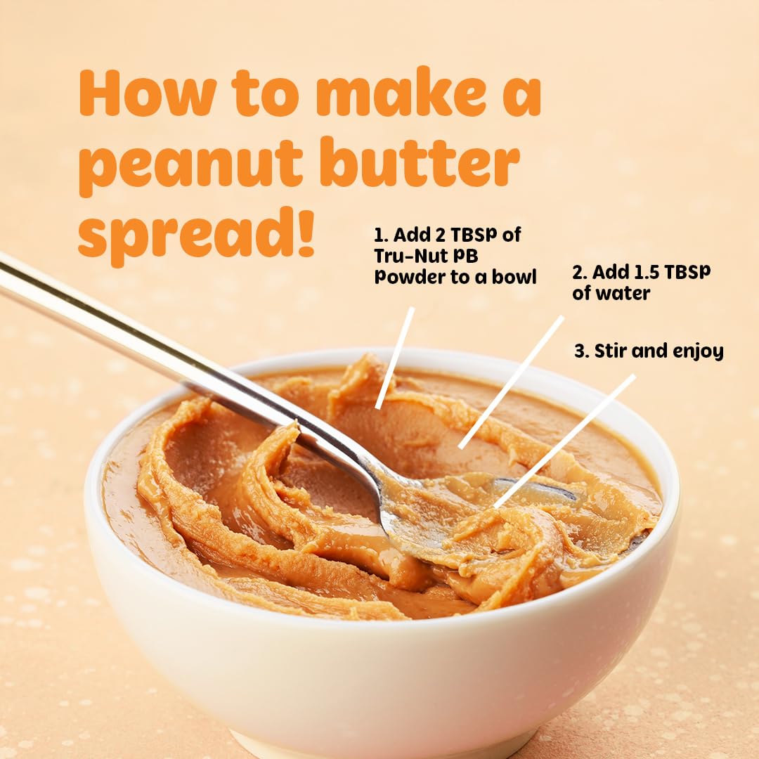 Spoon with Tru-Nut Powder ready to mix into shakes and recipes