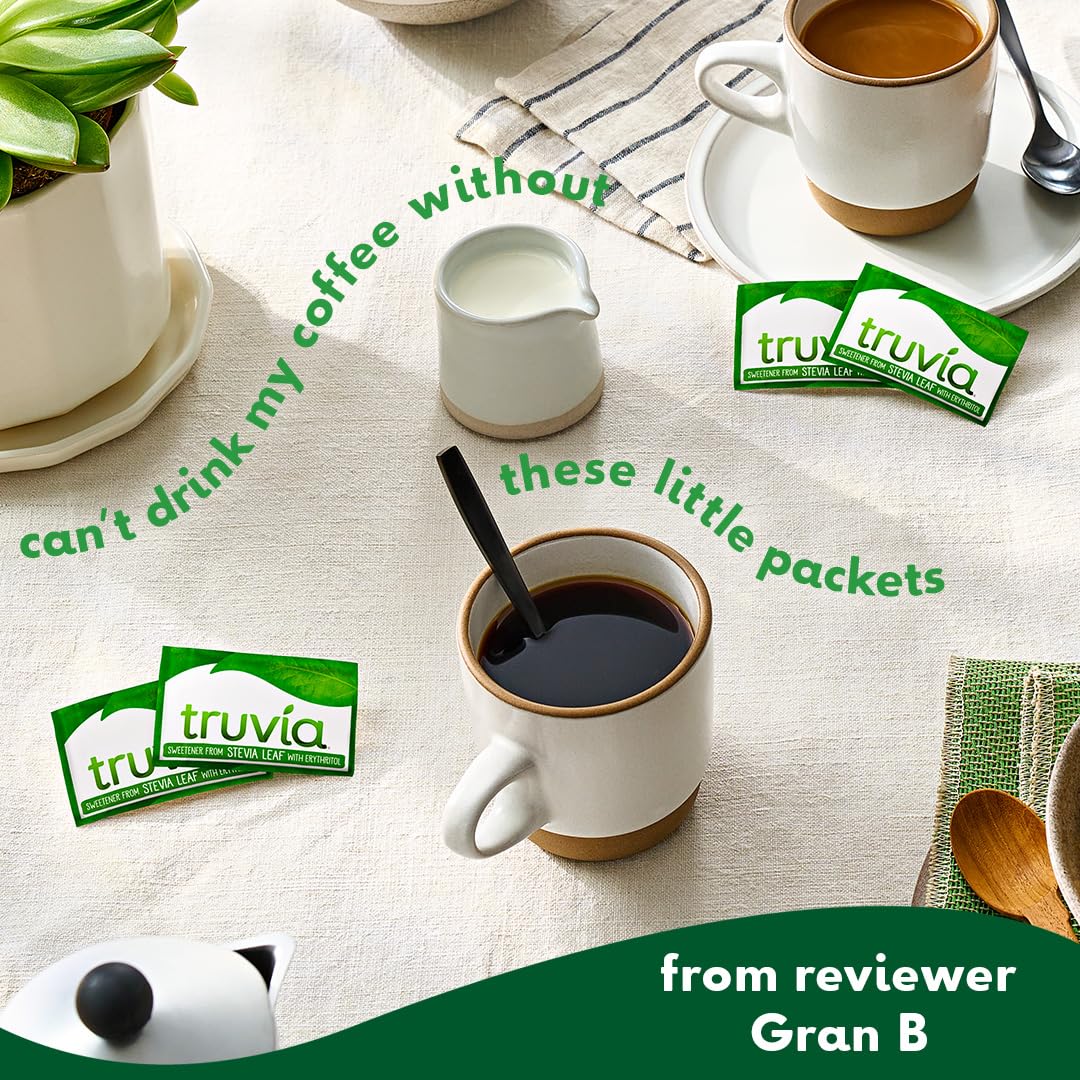Truvia packets beside a coffee cup for calorie-free sugar alternative.