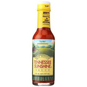 Try Me Tennessee Sunshine hot pepper sauce bottle pour showing vibrant color for grilled dishes.