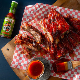 Try Me Tiger Sauce Original seafood plate delivers bold flavor onto seafood.