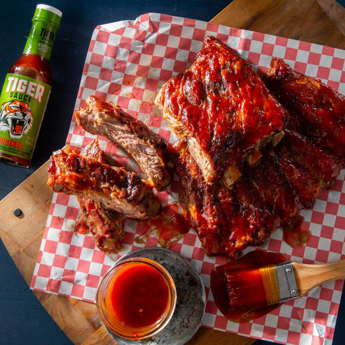 Tiger Sauce Original on grilled meat enhances flavor with sweet heat.