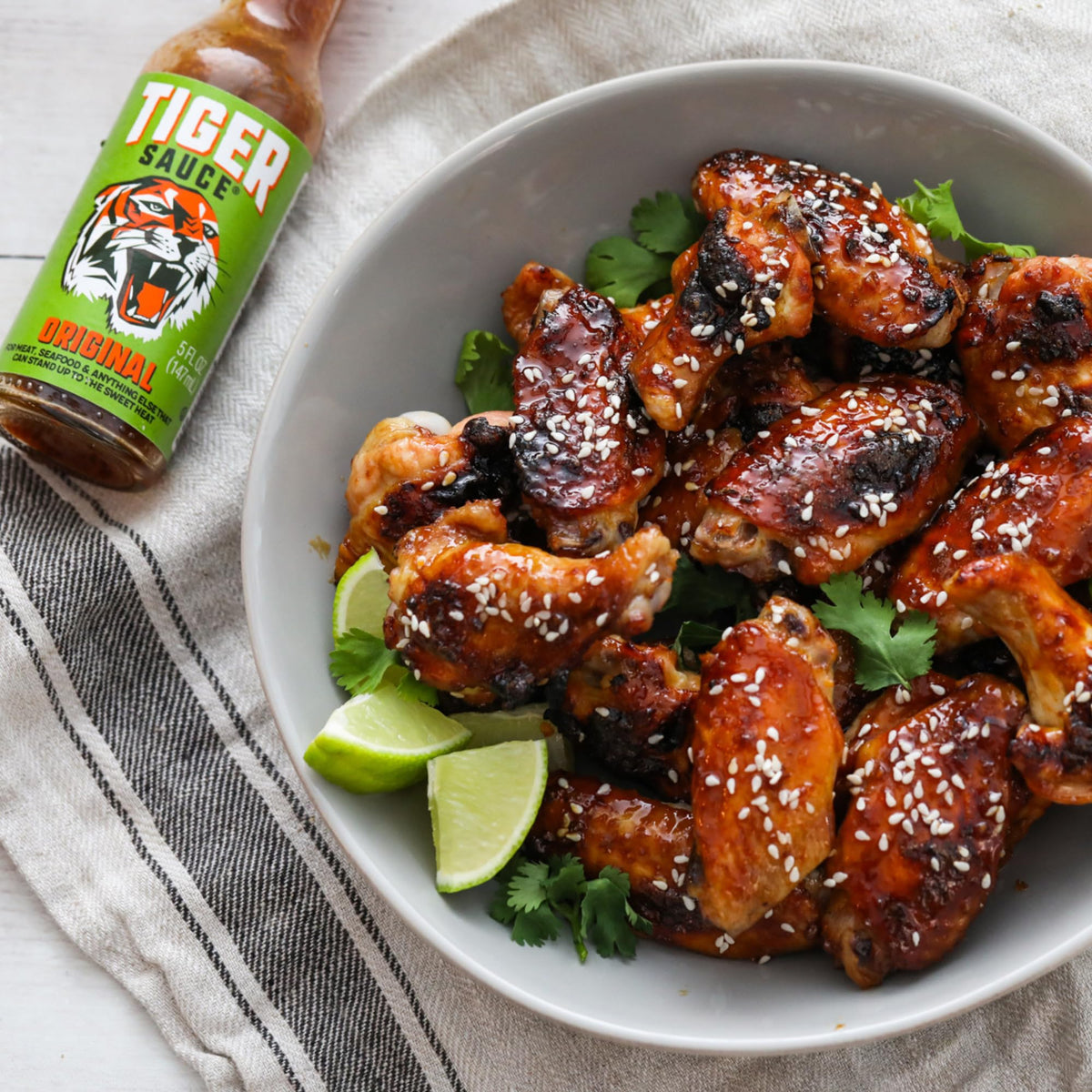 Try Me Tiger Sauce sizzling seafood image highlights compatible spice with dishes.