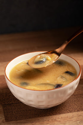 Tsubi Soup ready-to-serve cup with steaming aroma.