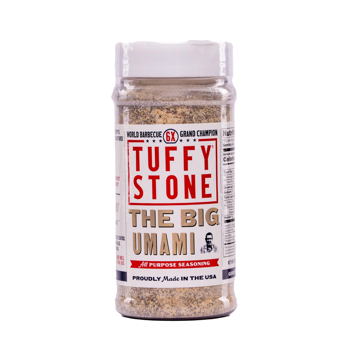 Tuffy Stone The Big Umami seasoning bottle pour enhances savory flavor on grilled foods.
