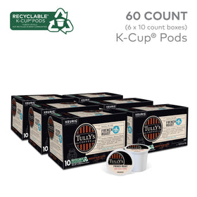 A close-up of TULLY'S French Roast K-Cup pods releasing rich aroma as coffee brews.