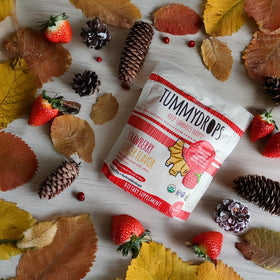 Tummydrops strawberry-ginger lozenge wrapped for travel-friendly convenience.