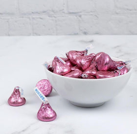 Pink foil Hershe.ysKISSES used as party decor for celebrations.