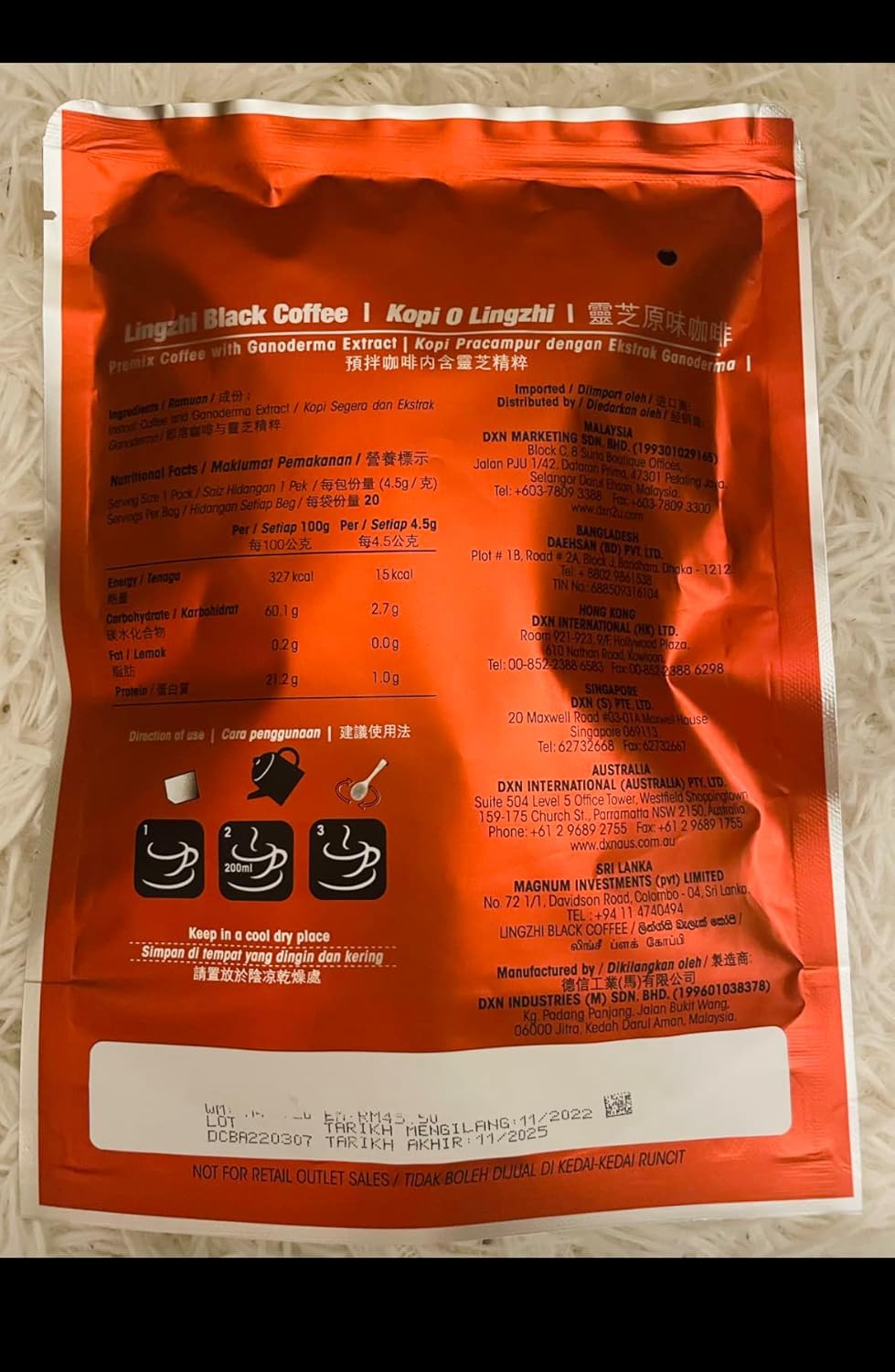 A steaming cup of Tunez Lingzhi Black Coffee with bold aroma ready to enjoy