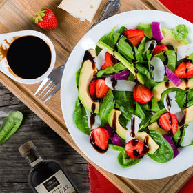 Tuscanini balsamic Modena drizzle over dish suggests gourmet finishing touch.