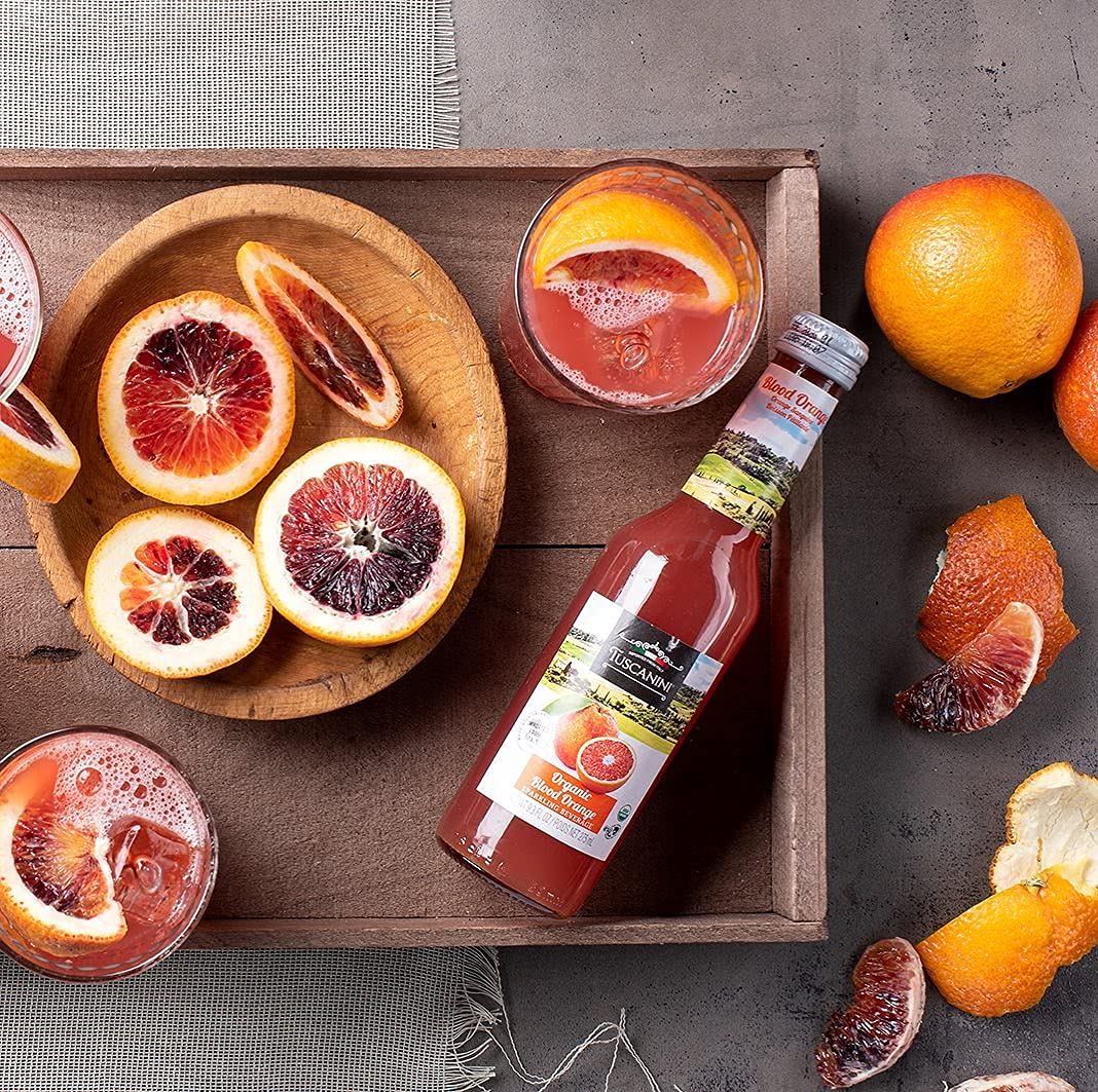 Tuscanini Organic Blood Orange Soda can, close-up of label for natural ingredients and kosher quality.