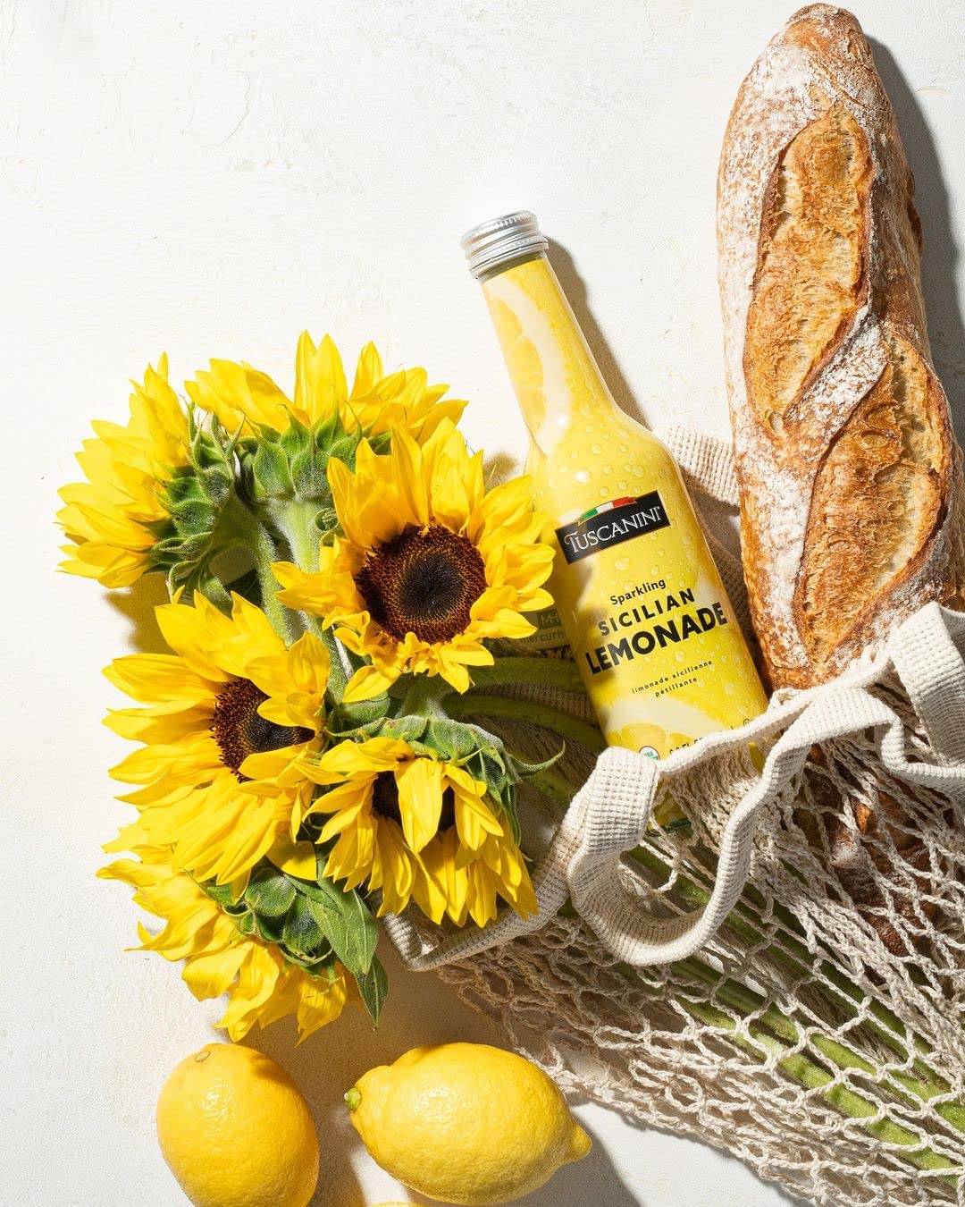 Tuscanini Organic Sparkling Lemonade bottle side view, premium glass packaging for elegant serving