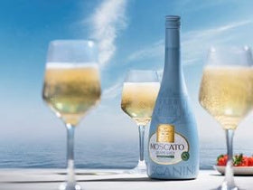 Chilled Tuscanini Moscato being poured over ice for refreshing mocktails.