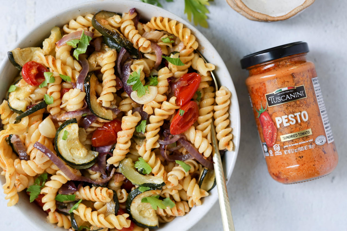 Tuscanini Sun-Dried Tomato Pesto spread on toast, flavorful topping