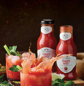 Tuscanini tomato juice being poured, ideal for cocktails and Bloody Marys