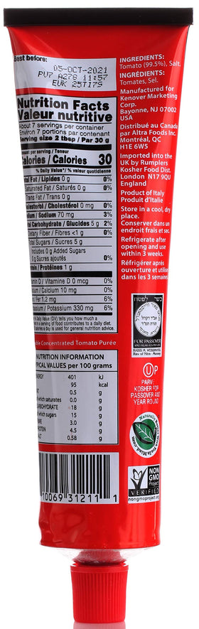 Stirring Tuscanini tomato paste into sauce for pasta or pizza.