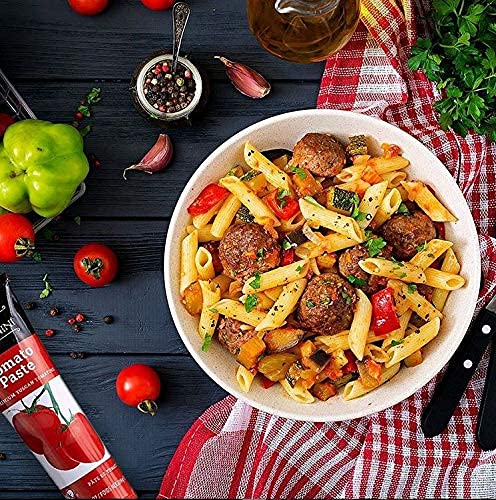 Tuscanini tomato paste label close-up highlighting premium Italian ingredients for sauces.