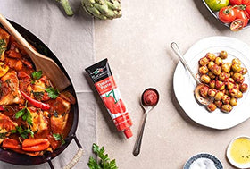 Tuscanini tomato paste tubes on shelf signaling a long-lasting pantry staple.
