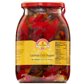 TUTTOCALABRIA chili peppers in oil in a glass jar for authentic Calabrian flavor.