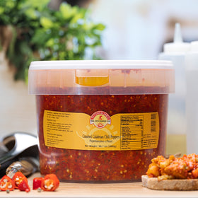TUTTOCALABRIA chili peppers on bread with olive oil, ideal appetizer.