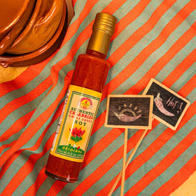 TUTTOCALABRIA ingredients display with Calabrian peppers signaling rich flavor.