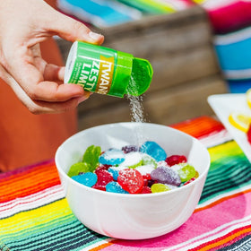 Twang Lime Snack Salt on vegetable sticks elevates crisp flavor.