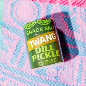 Chips topped with Twangerz pickle seasoning for a zesty bite