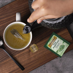 Aromatic steam rising from a mug of Twinings peppermint tea.