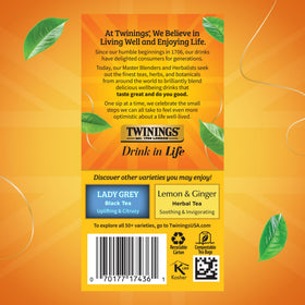Brewed Twinings tea steaming in a glass cup, hot or iced