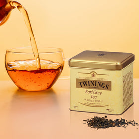Twinings Earl Grey loose leaves and spoon prepared for steeping