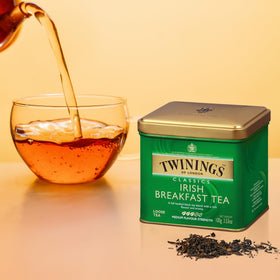Twinings Irish Breakfast tea leaves close-up reveal rich amber hue.