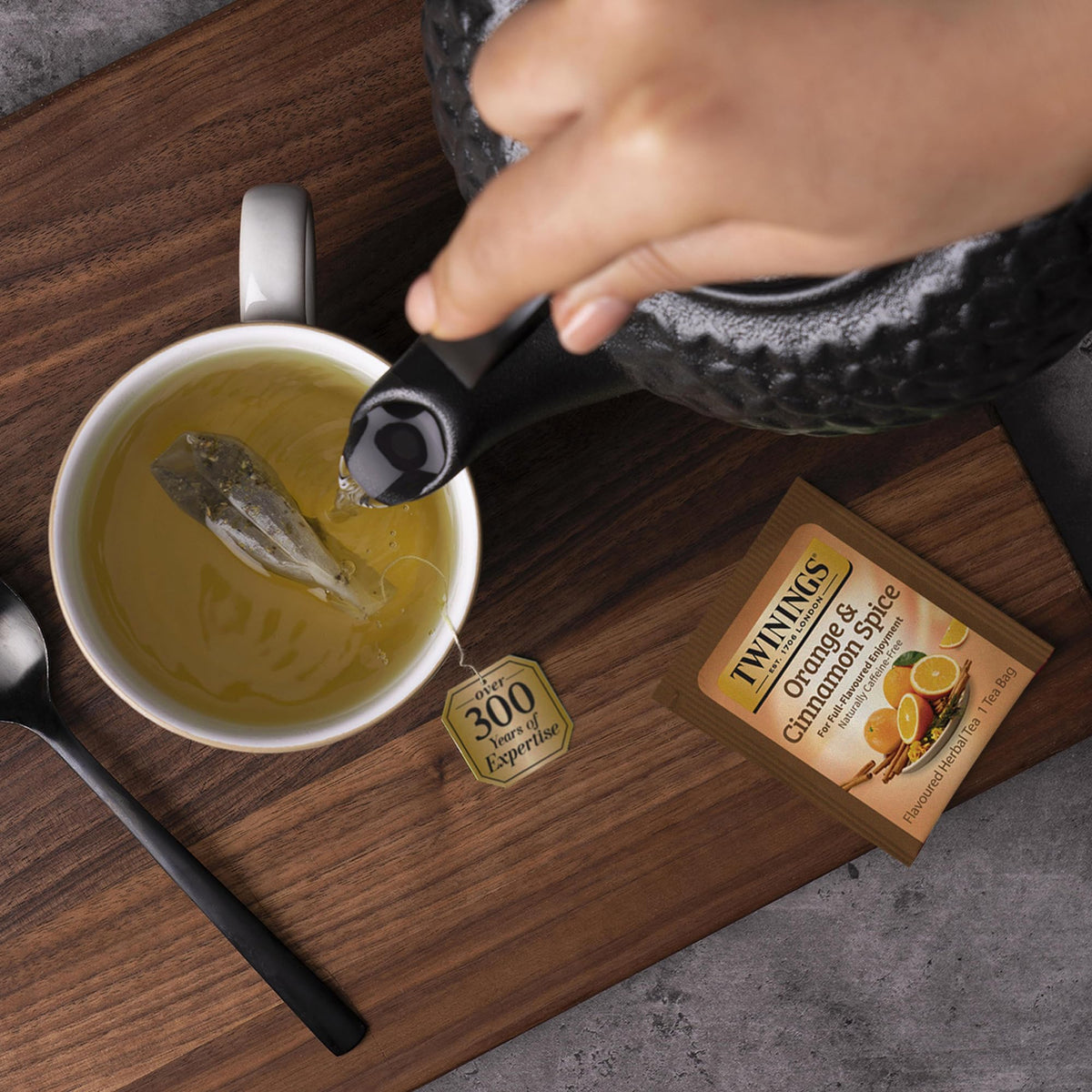 Twinings Orange Cinnamon Spice tea image with zesty citrus notes.