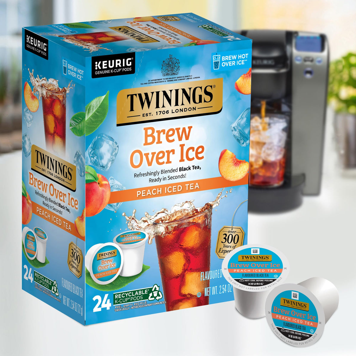 Ice-filled glass shows Twinings Peach Brew Over Ice ready to enjoy.