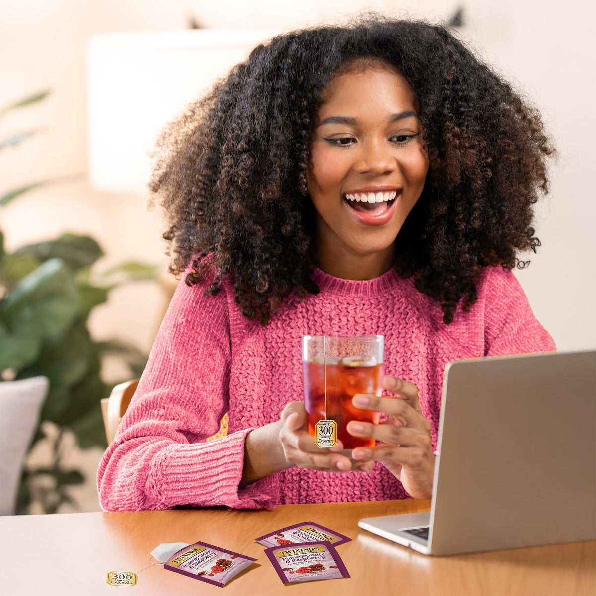 Twinings Pomegranate & Raspberry brew cup releasing a fragrant, fruity aroma.
