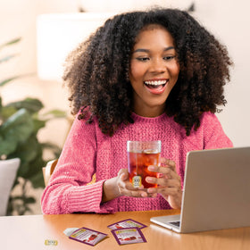 Twinings Pomegranate & Raspberry brew cup releasing a fragrant, fruity aroma.
