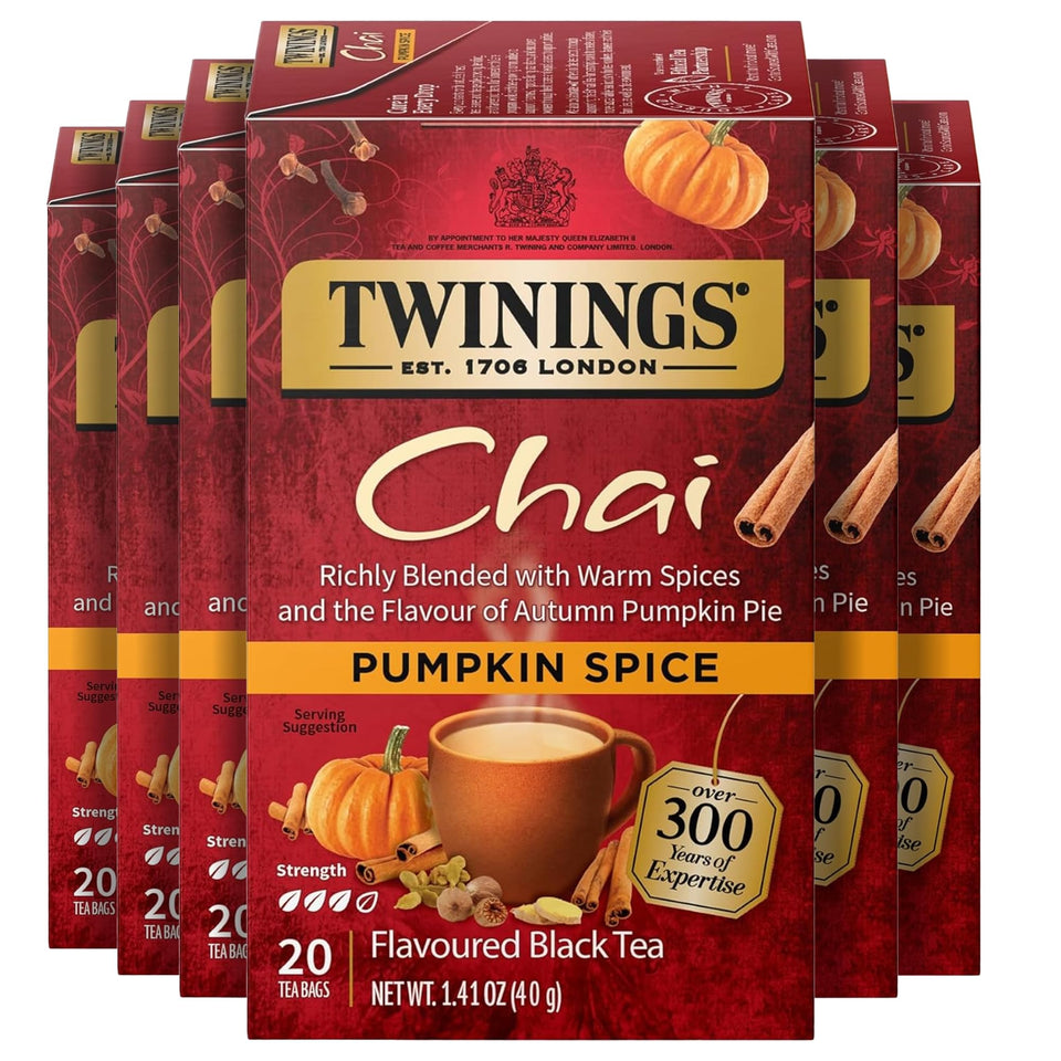Twinings Pumpkin Spice Chai tea bag beside a cozy mug, ideal for autumn mornings.