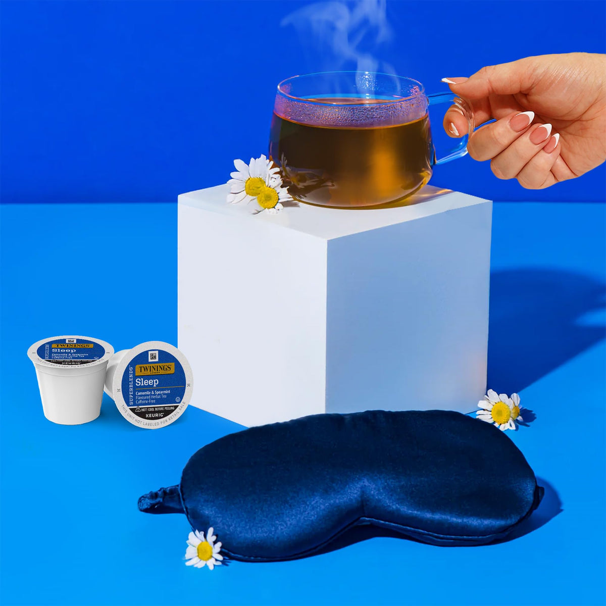 Cup of Twinings Sleep Herbal Tea K-Cups with warm camomile aroma.