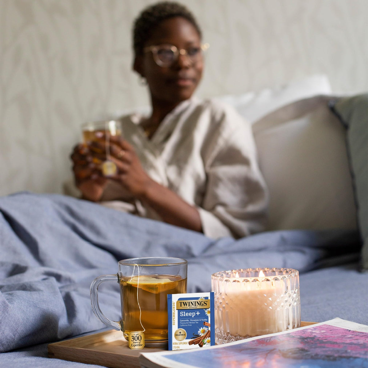 Close-up of chamomile infusion in Twinings Sleep+ highlighting a golden hue.