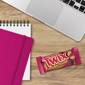 Cross-section of Twix cookie dough bar showing layers
