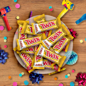 Twix Minis left-vs-right halves close-up, playful bite-sized treat.