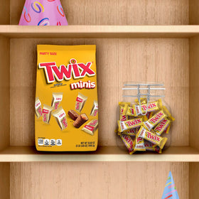 Twix Minis milk chocolate coating over caramel and biscuit, perfect snack.